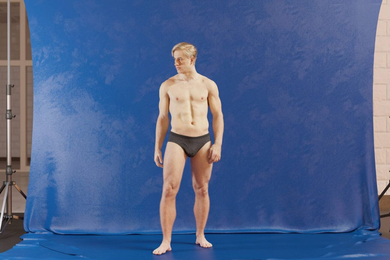 High-quality 3D male model with detailed anatomy standing in front of a blue backdrop, showcasing realistic skin textures and muscular definition, ideal for Daz3D asset projects.