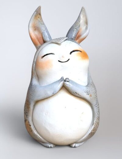 Cute bunny ceramic figurine with a cheerful expression, hand-painted details, and adorable features, perfect for home decor or collectible displays.