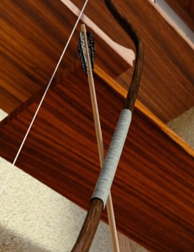 Arrow and bow with arrow nocked, wooden bow with wrapped grip and feathered arrow, set against wooden furniture and neutral background — 3D digital assets for archery or hunting themes.