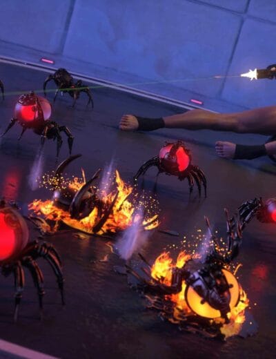 Futuristic sci-fi scene featuring a female warrior with red hair shooting at robotic spider-like enemies with glowing red and yellow orbs, set in high-tech environment.