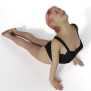 Woman with pink hair performing yoga Cobra Pose showcasing strength, flexibility, and serenity.