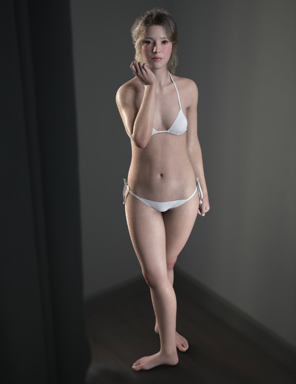 Woman posing in a white string bikini in a softly lit dark studio.